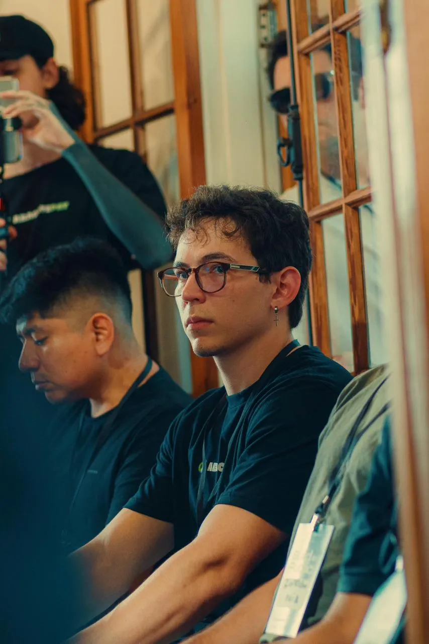 Arthur Nunes, wearing glasses, following a talk at a tech event